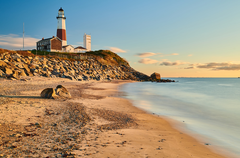 Montauk Lighthouse and beach at sunrise, Long Island, New York, USA.